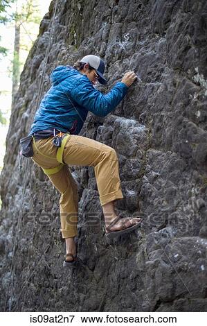 Stock Photo - "Man rock climbing, French's Dome, Zig Zag, Oregon, USA". Fotosearch