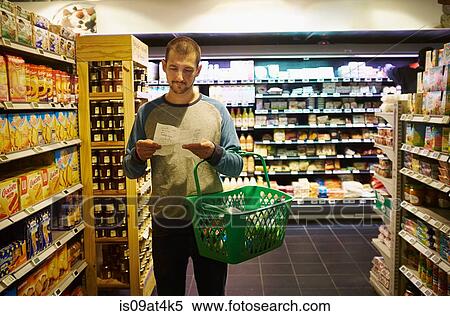 Stock Photography - Man shopping in supermarket. Fotosearch