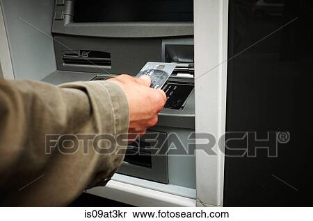 "Mid adult man using cash machine, focus on hands" View Large Photo Image Stock Photography - "Mid adult man using cash machine, focus on hands". Fotosearch