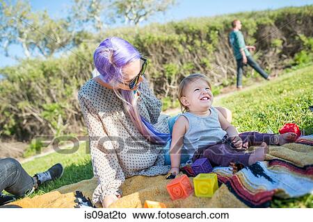 Picture - "Mother and baby at picnic, El Capitan, California, USA". Fotosearch