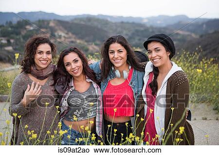 Portrait of four adult sisters on rural road View Large Photo Image Picture - Portrait of four adult sisters on rural road. Fotosearch