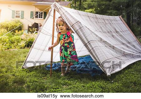 Portrait of girl peering from homemade garden tent View Large Photo Image Stock Photo - Portrait of girl peering from homemade garden tent. Fotosearch