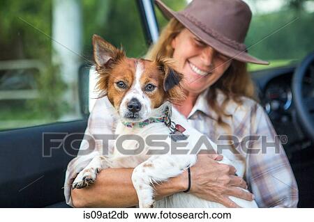 Portrait of mature woman with dog View Large Photo Image Stock Image - Portrait of mature woman with dog. Fotosearch