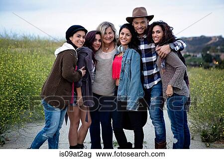 Portrait of mature woman with five adult children on rural road View Large Photo Image Stock Image - Portrait of mature woman with five adult children on rural road. Fotosearch