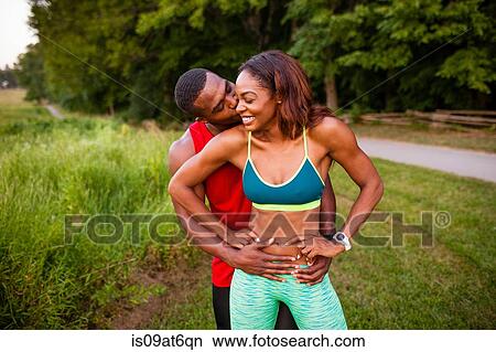 Portrait of romantic young couple training by rural road View Large Photo Image Picture - Portrait of romantic young couple training by rural road. Fotosearch