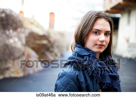 Stock Image - Portrait of teenage girl wearing scarf. Fotosearch