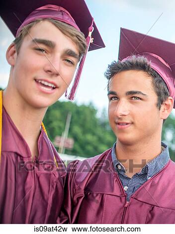 Portrait of two young men at graduation ceremony View Large Photo Image Stock Photo - Portrait of two young men at graduation ceremony. Fotosearch