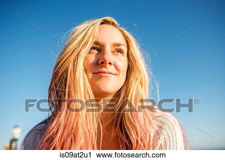 Portrait of woman enjoying sun View Large Photo Image Stock Image - Portrait of woman enjoying sun. Fotosearch