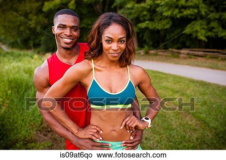 Portrait of young couple training by rural road View Large Photo Image Picture - Portrait of young couple training by rural road. Fotosearch