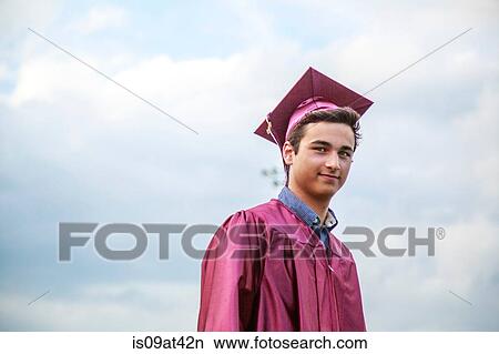 Portrait of young man at graduation ceremony View Large Photo Image Picture - Portrait of young man at graduation ceremony. Fotosearch
