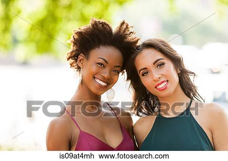 Stock Image - Portrait of young women. Fotosearch