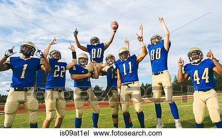 Teenage and young male American football team celebrating on soccer pitch View Large Photo Image Stock Image - Teenage and young male American football team celebrating on soccer pitch. Fotosearch