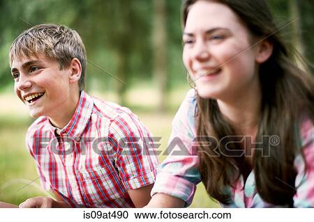 Teenage brother and sister laughing in woodland View Large Photo Image Stock Image - Teenage brother and sister laughing in woodland. Fotosearch