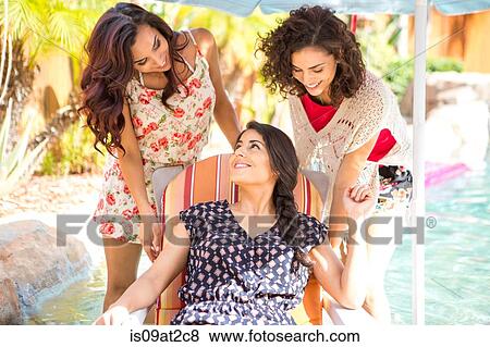 Three adult sisters talking on patio View Large Photo Image Stock Photo - Three adult sisters talking on patio. Fotosearch