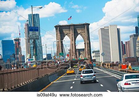 Stock Photograph - "Traffic crossing Brooklyn Bridge, Manhattan, New York, USA". Fotosearch