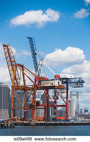 Stock Photograph - "Two loading cranes in harbor, New York, USA". Fotosearch