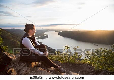 Stock Photograph - "Woman enjoying view on hill, Angel's Rest, Columbia River Gorge, Oregon, USA". Fotosearch