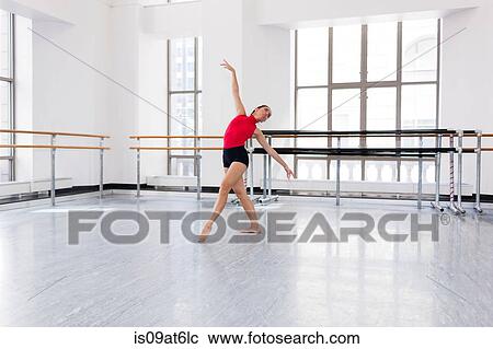 "Young woman in dance studio dancing, head back, arms raised" View Large Photo Image Stock Image - "Young woman in dance studio dancing, head back, arms raised". Fotosearch