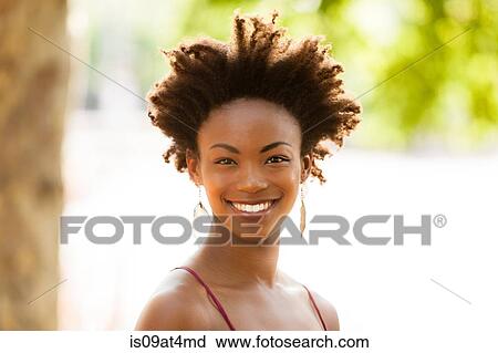 Young woman with afro hair View Large Photo Image Stock Image - Young woman with afro hair. Fotosearch