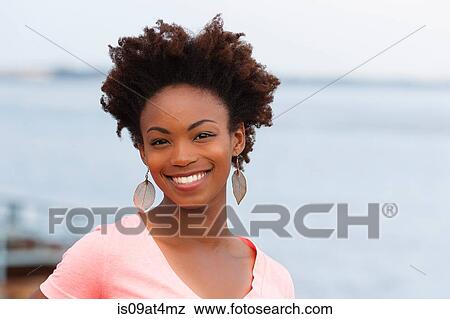 Young woman with afro hair View Large Photo Image Stock Photo - Young woman with afro hair. Fotosearch