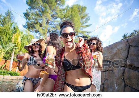 Young woman with sisters and brother drinking cocktails in garden View Large Photo Image Stock Photography - Young woman with sisters and brother drinking cocktails in garden. Fotosearch