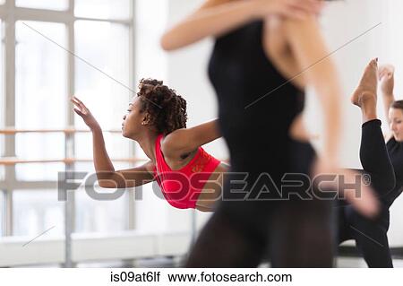 "Young women in dance studio dancing, differential focus" View Large Photo Image Stock Image - "Young women in dance studio dancing, differential focus". Fotosearch