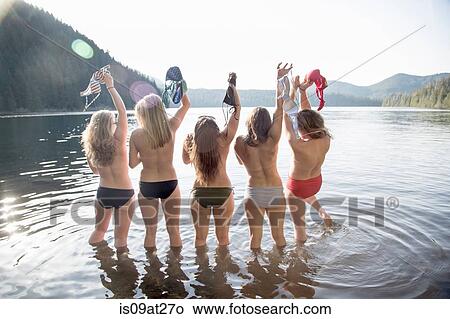 "Young women taking off bikini tops, Lost Lake, Oregon, USA" View Large Photo Image Picture - "Young women taking off bikini tops, Lost Lake, Oregon, USA". Fotosearch
