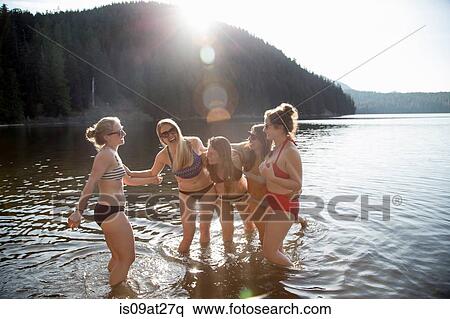 "Young women wearing bikinis, Lost Lake, Oregon, USA" View Large Photo Image Stock Photography - "Young women wearing bikinis, Lost Lake, Oregon, USA". Fotosearch