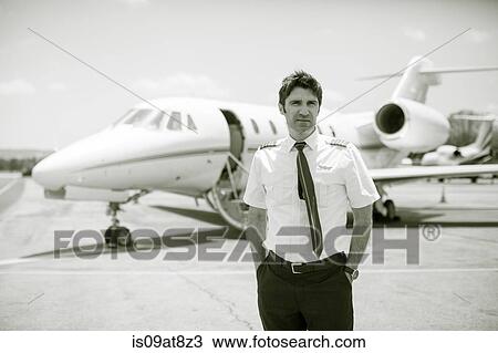 Black and white portrait of male private jet pilot at airport View Large Photo Image Stock Image - Black and white portrait of male private jet pilot at airport. Fotosearch