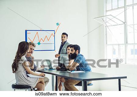 Picture - Business people in brainstorming meeting. Fotosearch