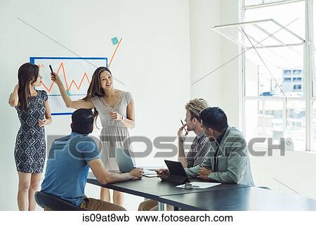Business people in brainstorming meeting View Large Photo Image Stock Image - Business people in brainstorming meeting. Fotosearch