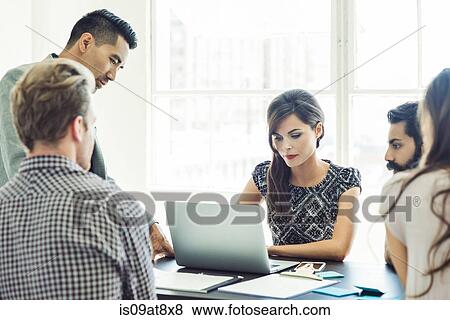 Business people in brainstorming meeting View Large Photo Image Stock Photo - Business people in brainstorming meeting. Fotosearch
