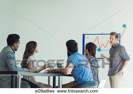 Business people in brainstorming meeting View Large Photo Image Stock Photograph - Business people in brainstorming meeting. Fotosearch