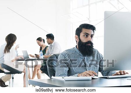 Business people working on computer at office View Large Photo Image Stock Image - Business people working on computer at office. Fotosearch
