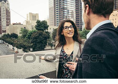 Businessman and woman talking in city, Los Angeles, USA View Large Photo Image Stock Image - Businessman and woman talking in city, Los Angeles, USA. Fotosearch