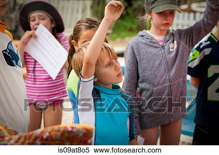 Children wearing swimwear hands raised to answer question View Large Photo Image Stock Photography - Children wearing swimwear hands raised to answer question. Fotosearch
