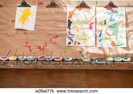 Children's paintings, hanging to dry View Large Photo Image Stock Image - Children's paintings, hanging to dry. Fotosearch