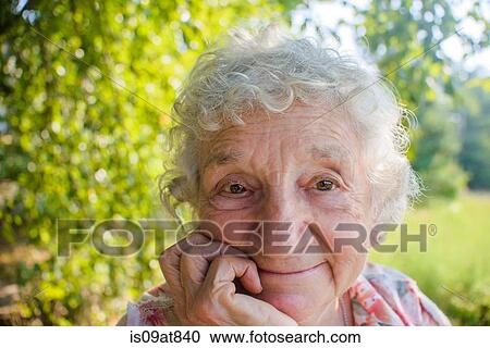 Close up of smiling senior woman outdoors View Large Photo Image Stock Image - Close up of smiling senior woman outdoors. Fotosearch