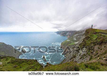Daughter sitting on fathers shoulders looking at view from cliff, Slieve Legue, County Donegal, Ireland View Large Photo Image Stock Photo - Daughter sitting on fathers shoulders looking at view from cliff, Slieve Legue, County Donegal, Ireland. Fotosearch