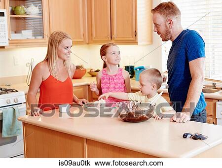 Family baking in kitchen View Large Photo Image Stock Image - Family baking in kitchen. Fotosearch