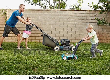 Family mowing lawn in backyard View Large Photo Image Stock Photography - Family mowing lawn in backyard. Fotosearch