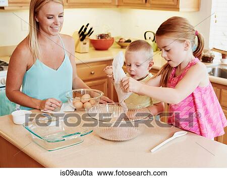 Family preparing batter in mixing bowl View Large Photo Image Stock Image - Family preparing batter in mixing bowl. Fotosearch