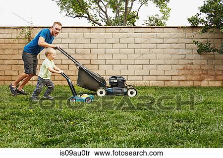 Father and son mowing lawn in backyard View Large Photo Image Stock Photography - Father and son mowing lawn in backyard. Fotosearch