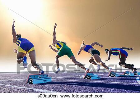Four female athletes on athletics track, leaving starting blocks, rear view View Large Photo Image Picture - Four female athletes on athletics track, leaving starting blocks, rear view. Fotosearch