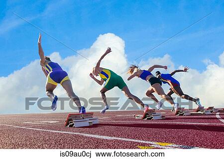 Four female athletes on athletics track, leaving starting blocks, rear view View Large Photo Image Stock Image - Four female athletes on athletics track, leaving starting blocks, rear view. Fotosearch