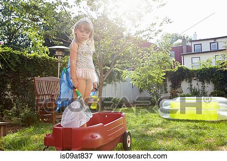 Girl in butterfly costume standing in toy wagon View Large Photo Image Stock Photo - Girl in butterfly costume standing in toy wagon. Fotosearch