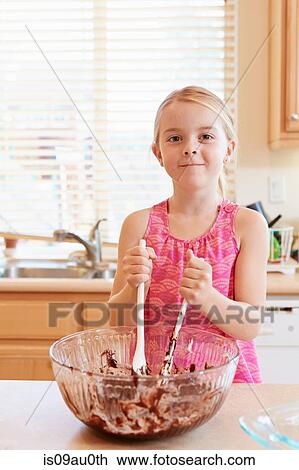 Girl melting chocolate in mixing bowl View Large Photo Image Stock Image - Girl melting chocolate in mixing bowl. Fotosearch