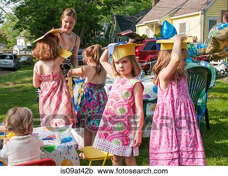Group of children at kindergarten graduation, wearing paper mortar boards View Large Photo Image Stock Image - Group of children at kindergarten graduation, wearing paper mortar boards. Fotosearch