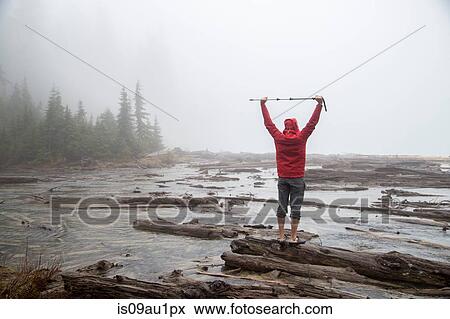 Hiker by lake, Lake Blanco, Washington, USA View Large Photo Image Stock Photo - Hiker by lake, Lake Blanco, Washington, USA. Fotosearch