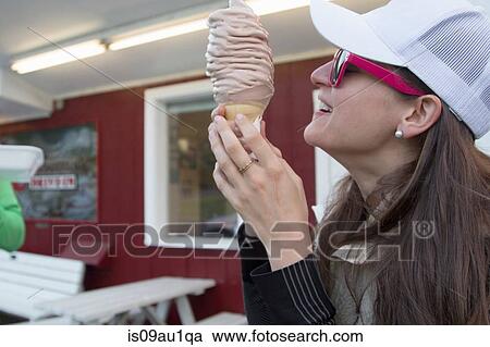 Hiker enjoying ice cream cone at cafe, Lake Blanco, Washington, USA View Large Photo Image Stock Image - Hiker enjoying ice cream cone at cafe, Lake Blanco, Washington, USA. Fotosearch